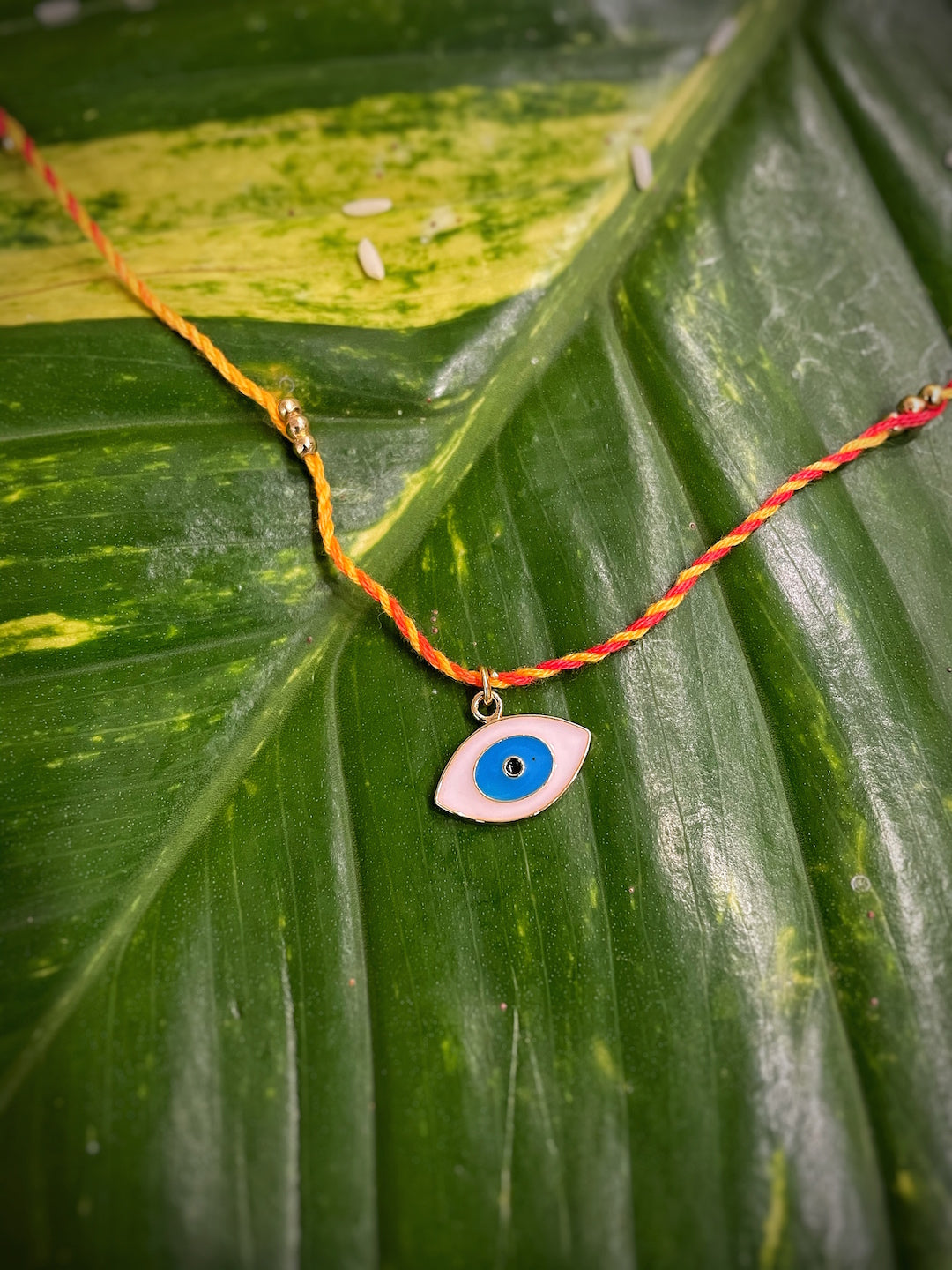 image for Modern Designer Rakhi Evil Eye Charm With Multicolored Thread Rakhi For Raksha Bandhan