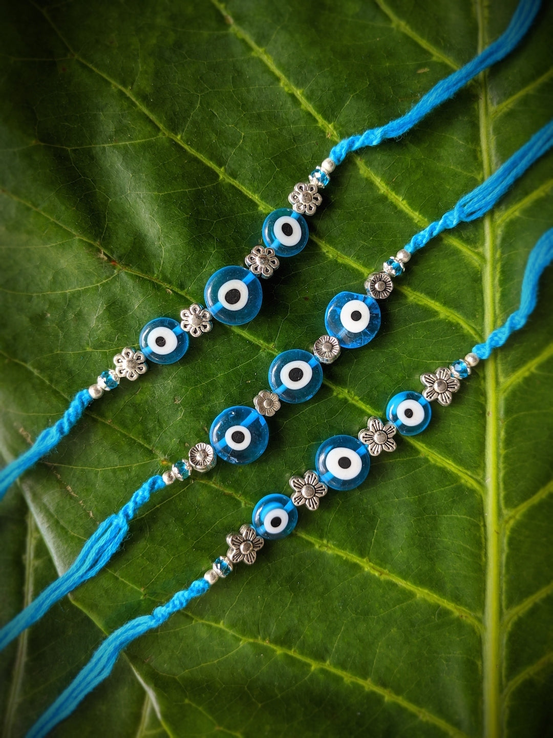 image for (COMBO of 3) Fancy Evil Eye Rakhi Design Turkish Charm Multicoloured Mauli Raksha Bandhan