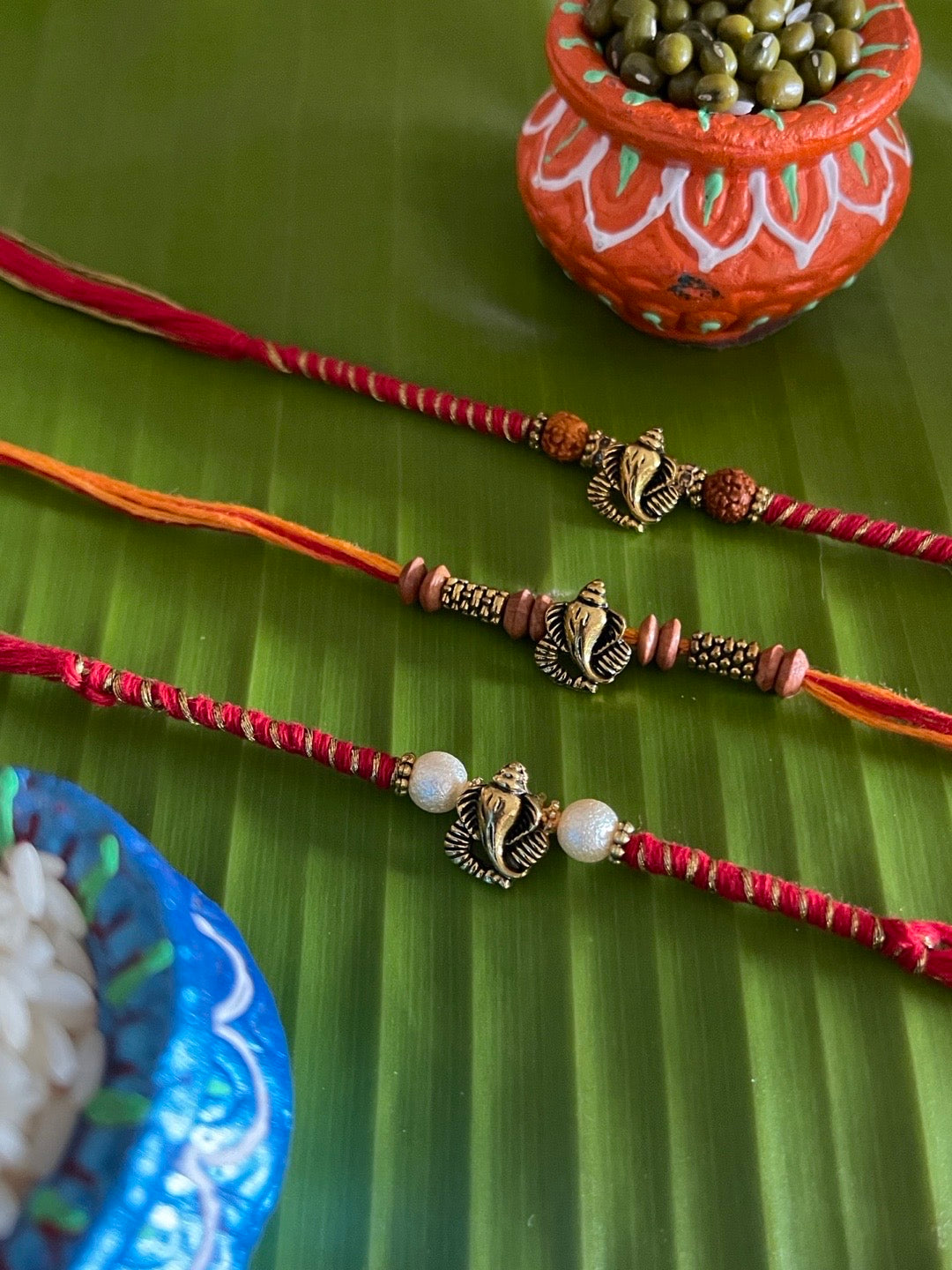 image for (Rakhi Set of 3) Designer Ganesh Rakhi With Beads & Rudraksha Mauli Thread Rakhi For Rakshabandhan