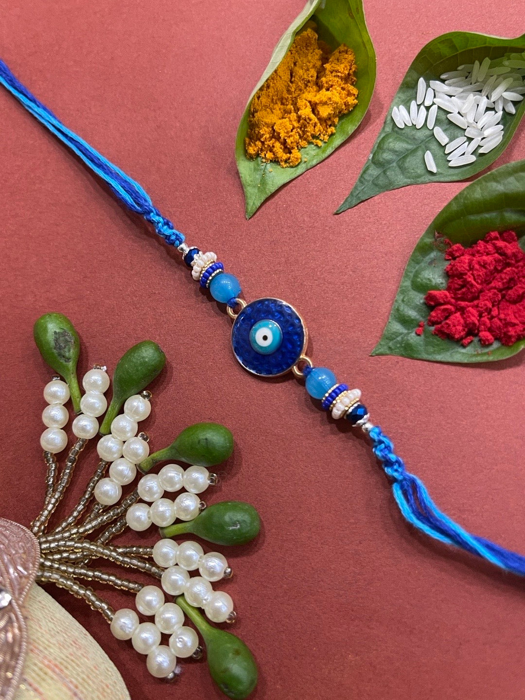 image for Beautiful Designer Rakhi Dark Blue Eye Evil With Beads Multicolor Thread Rakhi For Brother