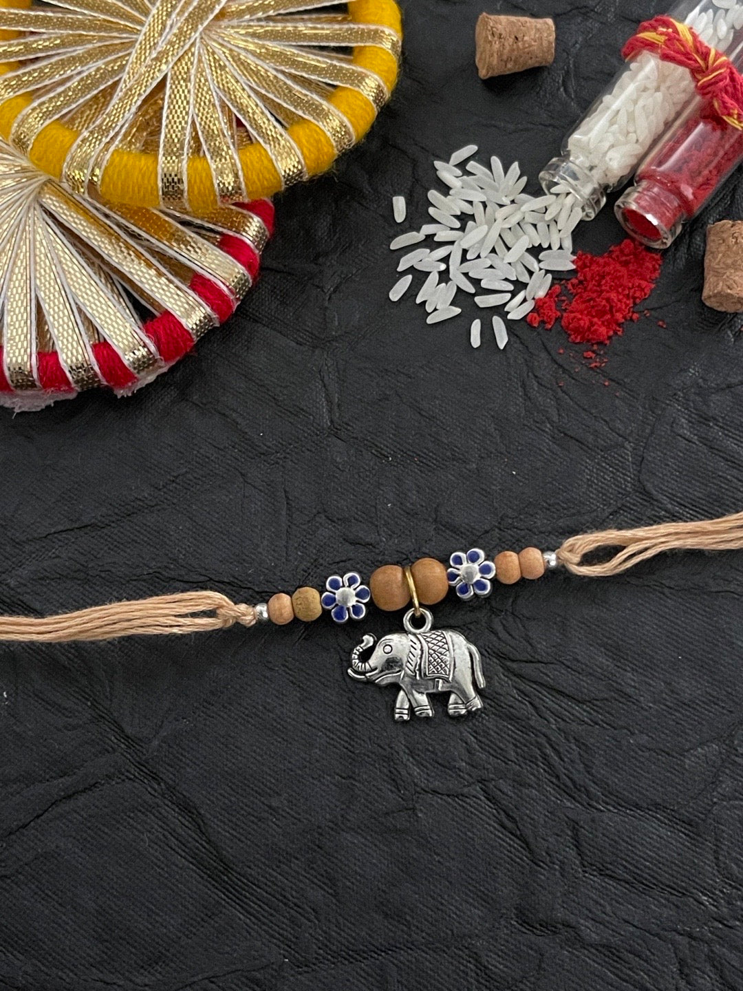 image for Beautiful Designer Chandan Rakhi Flower Designs With Elephant Charm Thread Rakhi For Raksha Bandhan