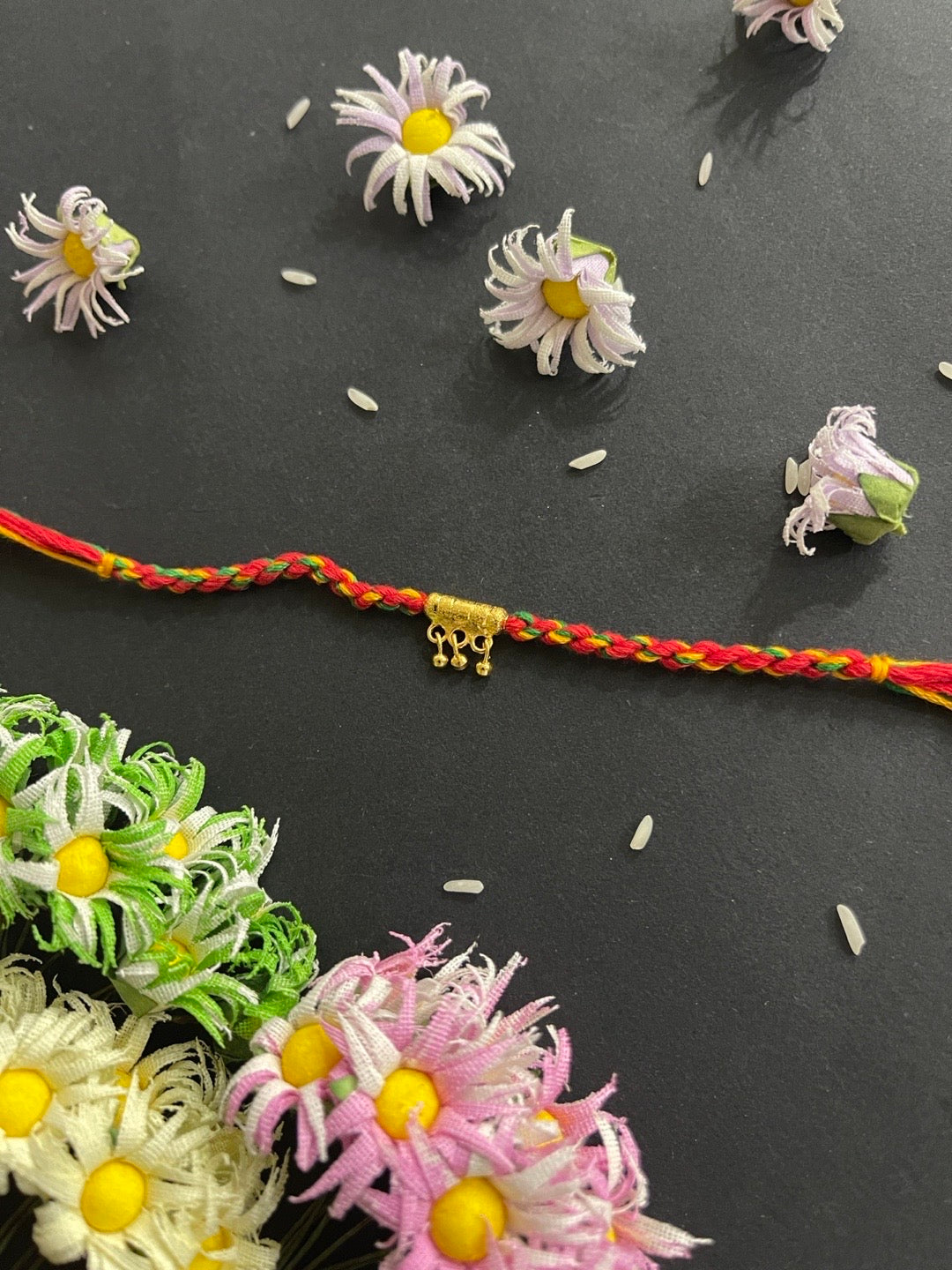 image for Simple Unique Rakhi With Ghungroo Criss Cross Thread Rakhi For Raksha Bandhan