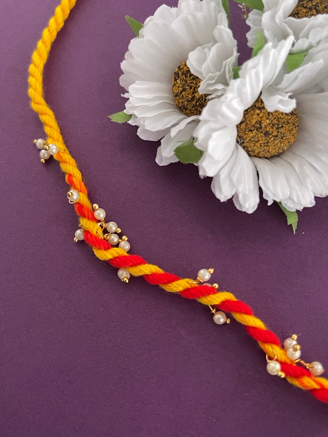 image for Simple Rakhi With Pearl Ghungroo Pooja Mauli Rakhi Thread For Raksha Bandhan