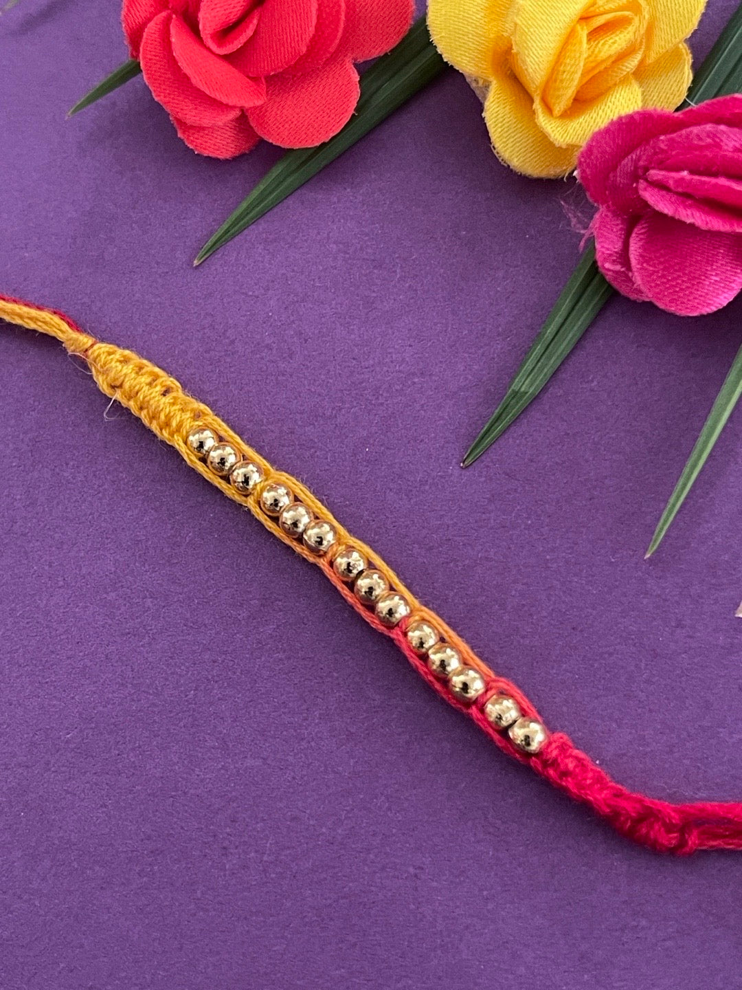 image for Latest Simple Golden Beaded Rakhi Criss Cross Mauli Thread Rakhi For Raksha Bandhan