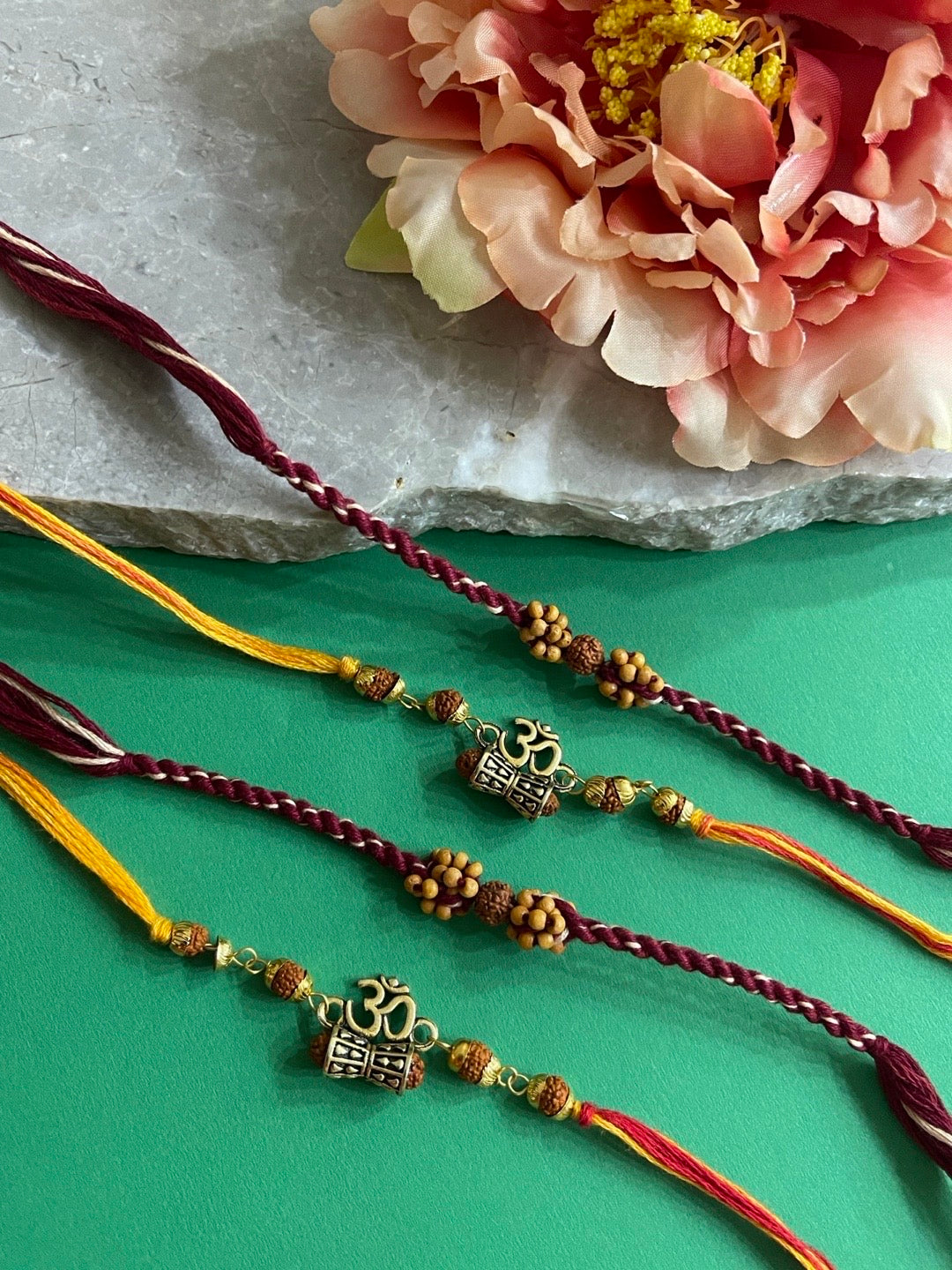 image for (Rakhi Set of 4) Unique Rudraksha Rakhi Om/Damru With multicolour Thread Rakhi For Raksha Bandhan