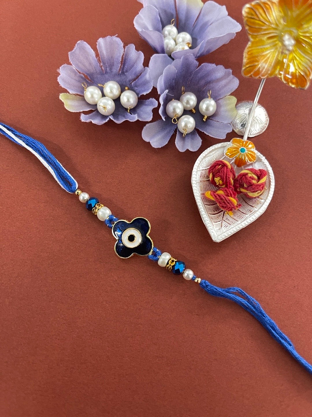 image for Designer Navy Blue Evil Eye Flower Rakhi With Beads And Crystal Thread Rakhi For Raksha Bandhan