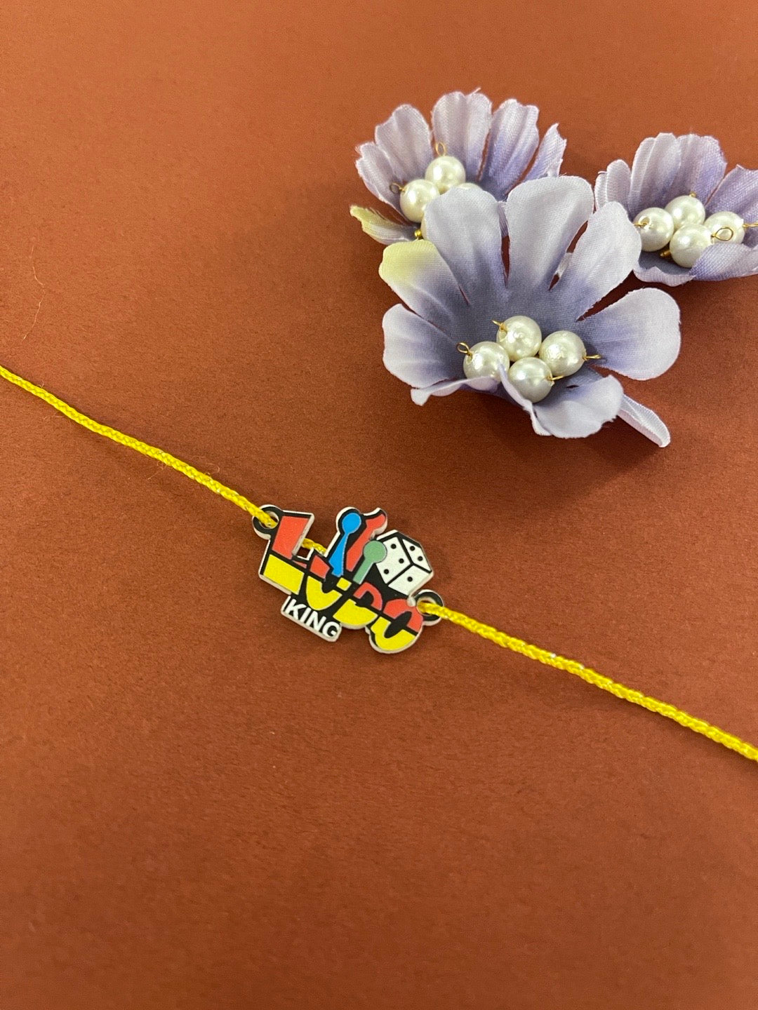 image for Unique Designer Ludo King Game Rakhi With Yellow Thread Rakhi For Raksha Bandhan