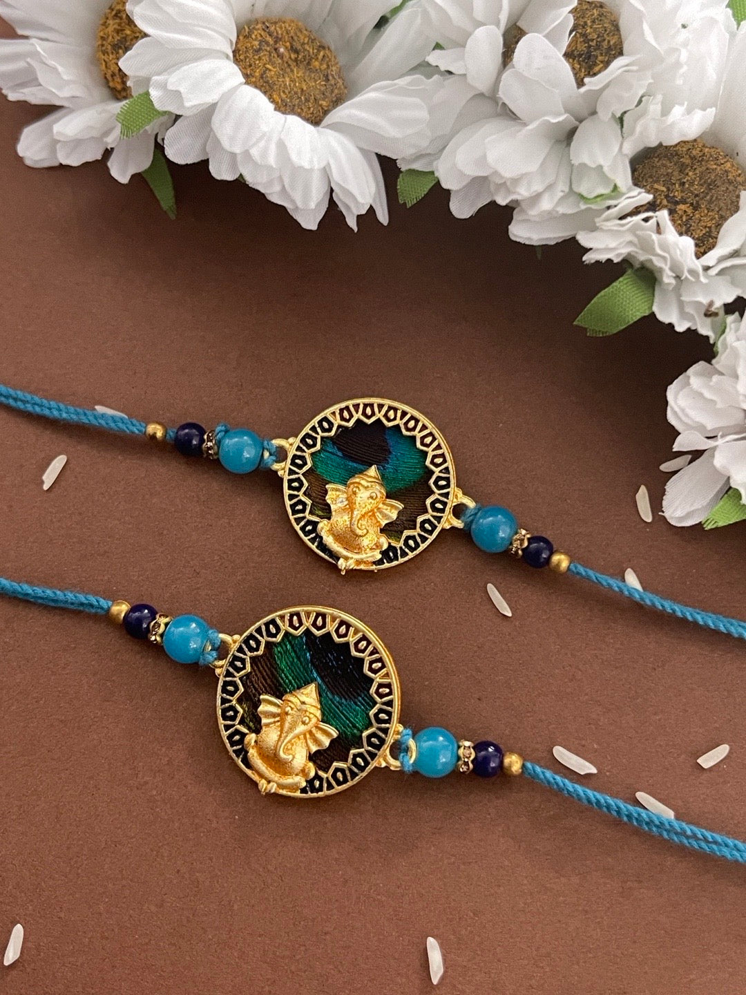 image for (Combo of 2) Designer Rakhi Round Peacock Feather Lord Ganesha With Beads Blue Thread Rakhee