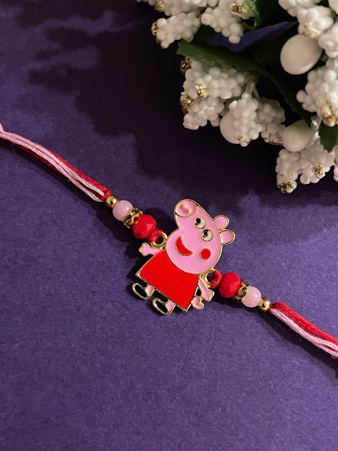 image for Unique Peppa Pig Cartoon Rakhi With Crystal Beads Pink/Red Thread Rakhi For Raksha Bandhan