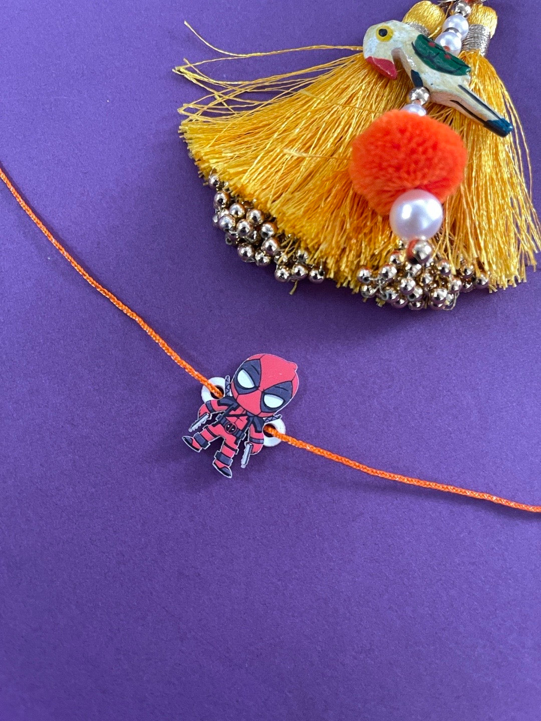 image for Fancy Designer Deadpool Cartoon Rakhi Orange Thread Rakhi For Small Brother