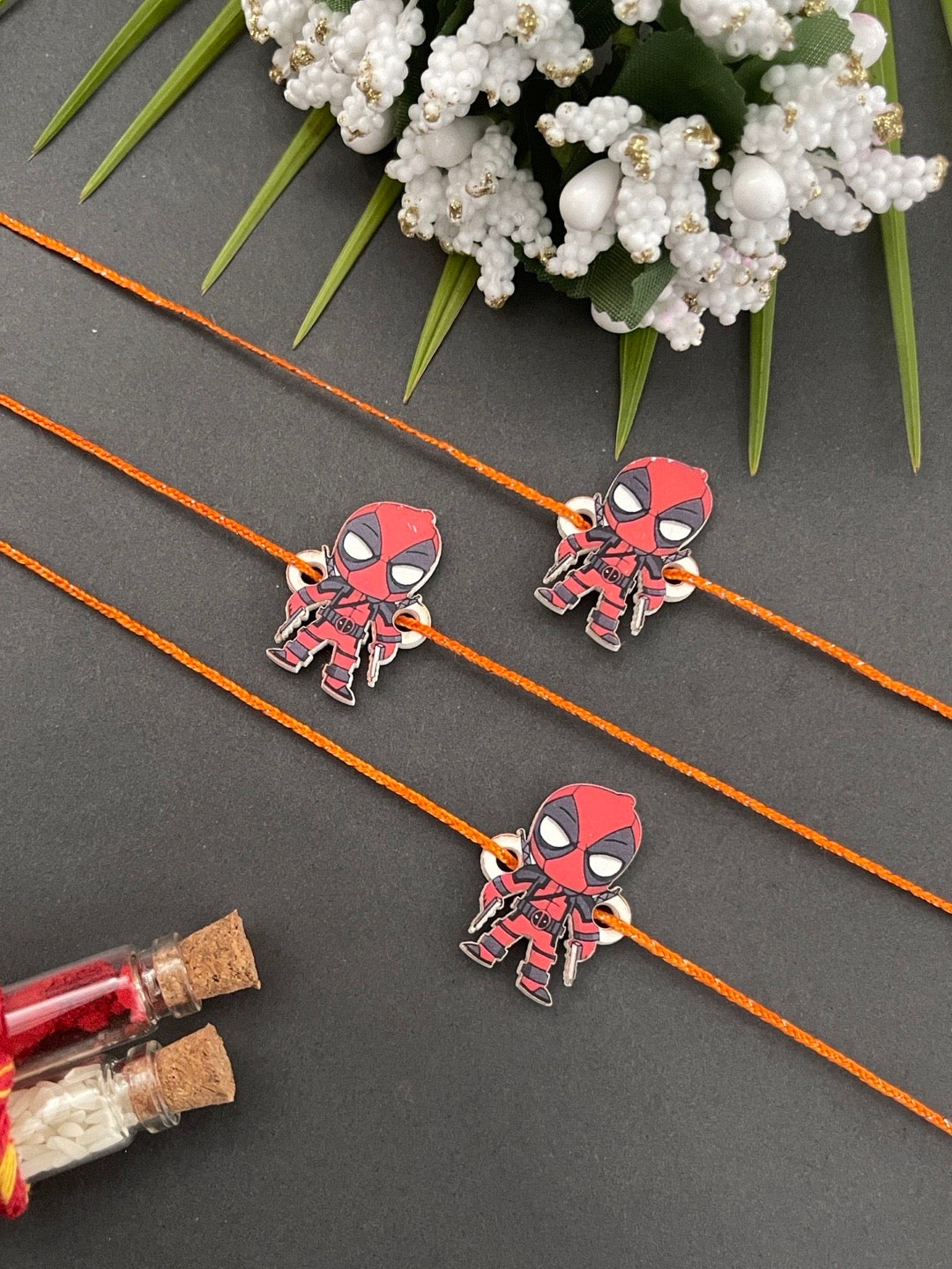 image for (Combo of 3) Fancy Designer Deadpool Cartoon Rakhi Orange Thread Rakhi For Small Brother