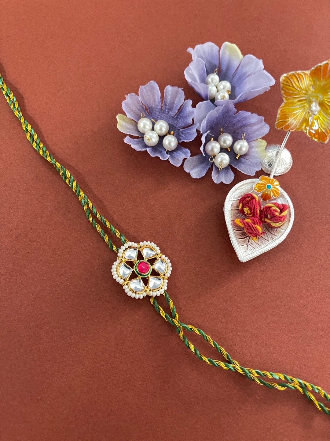 image for Designer Kundan Flower Rakhi With Green/Golden Thread Rakhi For Raksha Bandhan