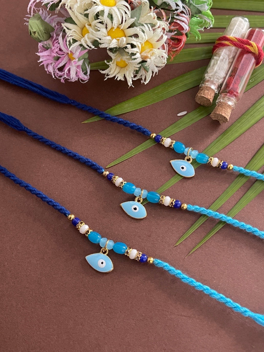 image for (Rakhi Set of 3) Unique Designer Rakhi Blue Evil Eye Charm With multicolour Beads Thread Rakhi