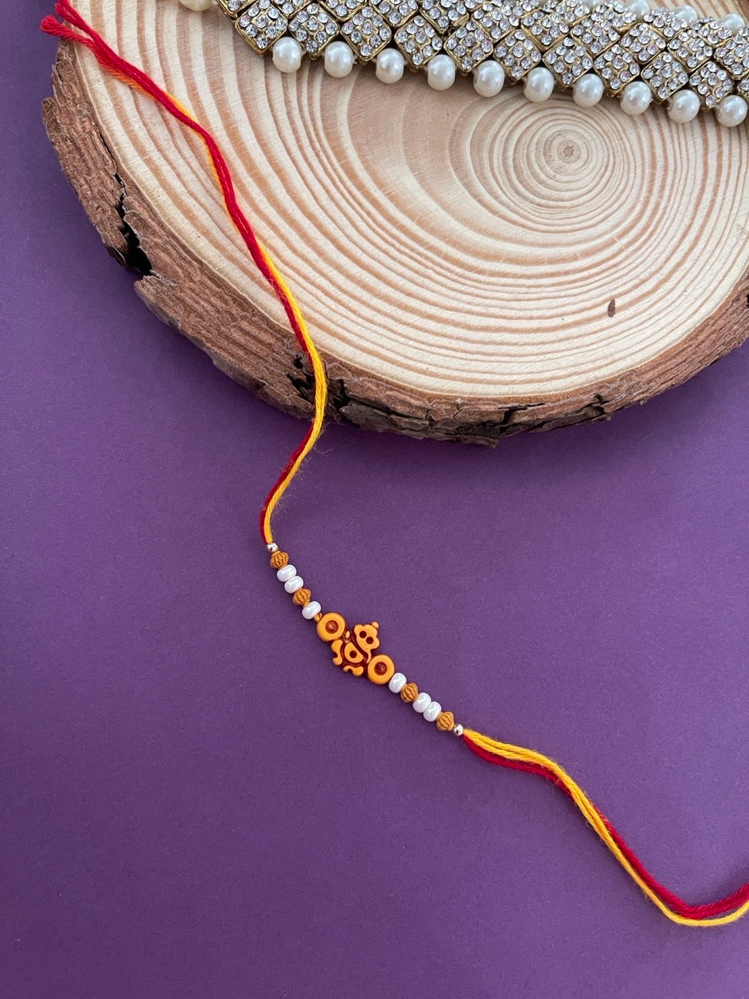 image for Beautiful Designer Rakhi Lord Ganesha With Beads And Moti Mauli Thread Rakhi For Rakshabandhan