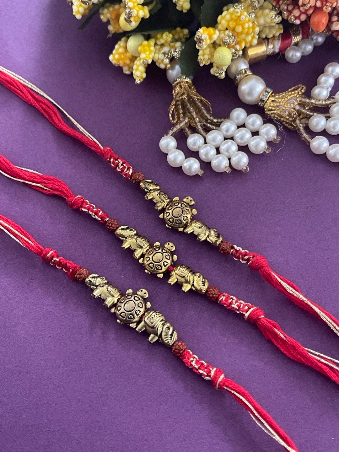 image for (Combo of 3) Designer Rakhi Tortoise/Elephant With Rudraksha Bead Red Thread Rakhi For RakshaBandhan