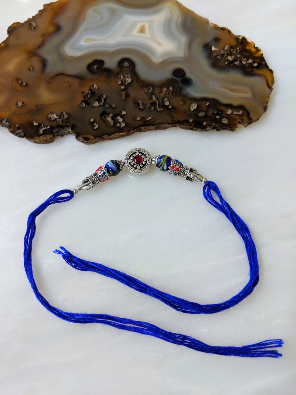 image for Tibetan Designer Rakhi for Men with Silver Plated Blue Gemstone Thread Rakhi for Brother