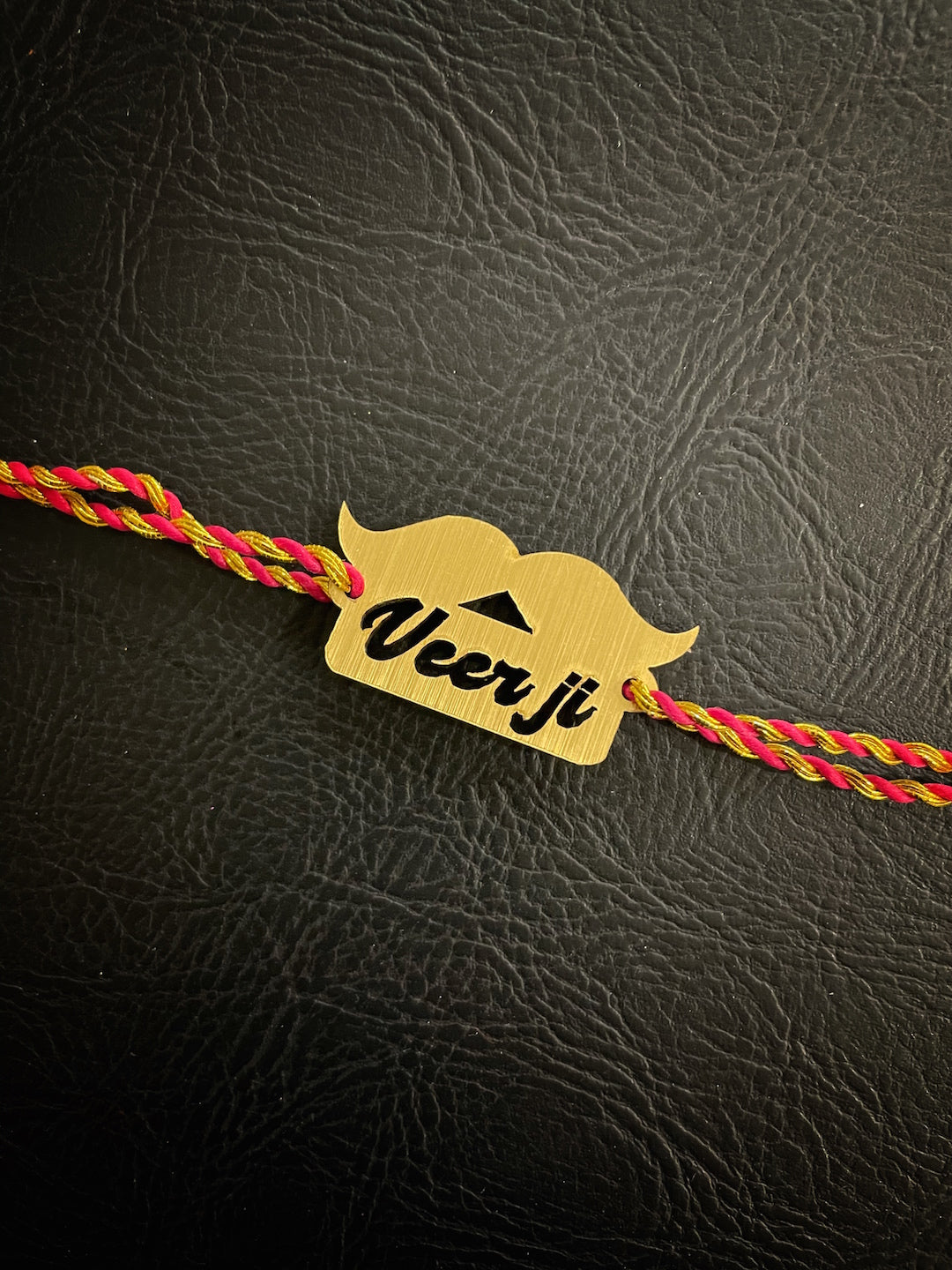 image for Fancy Rakhi Design Funky Slogan Moustache/Muchchad Veerji Multicoloured Mauli Raksha Bandhan