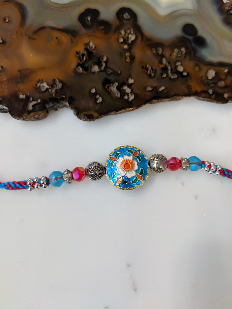 image for Enamel Work Designer Rakhi Silver Flower Multicolor Beads Thread Rakhi for Men