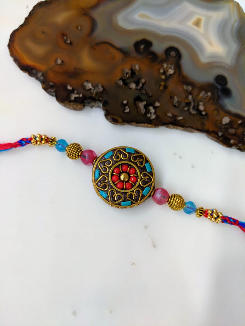 image for Golden Rakhi Round Pendant Beads Multicolor Thread Designer Rakhi For Men