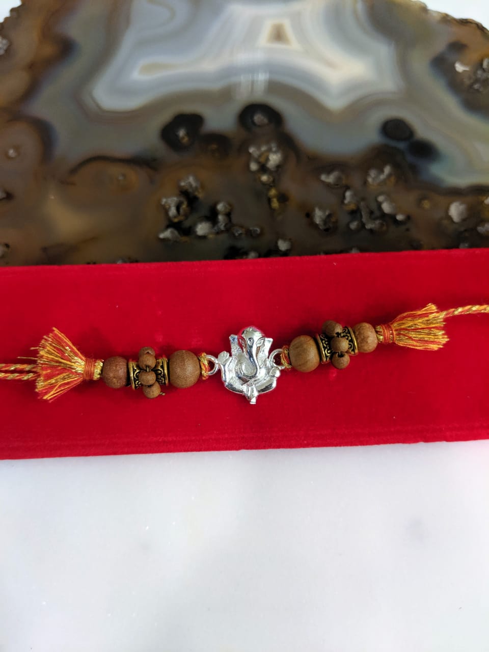 image for Silver Rakhi Ganesh Ji Designer Wood Beads Multicolor Thread Rakhi For Men