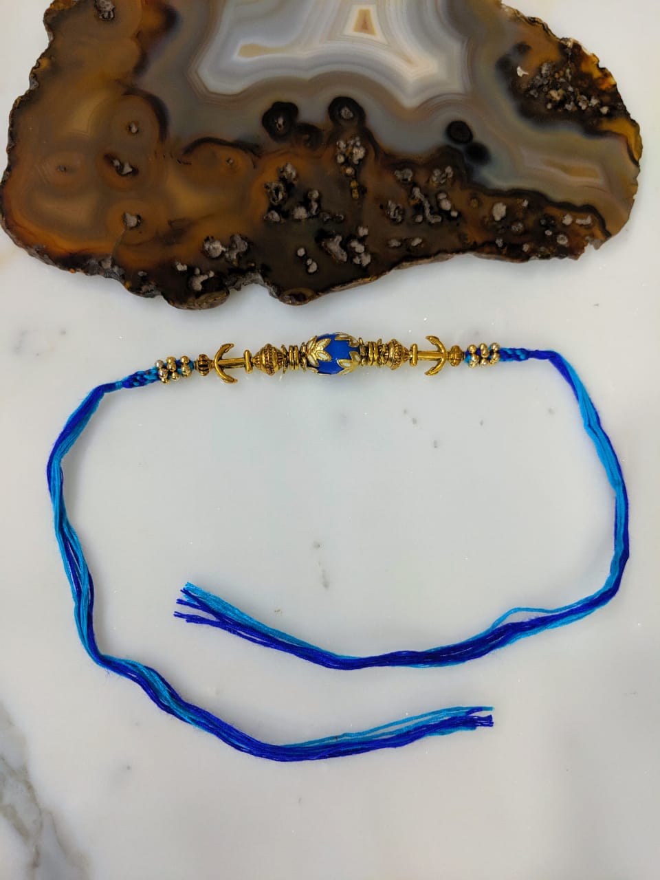 image for Tibetan Designer Gold Plated Blue Gemstone Multicolor Thread Rakhi For Men