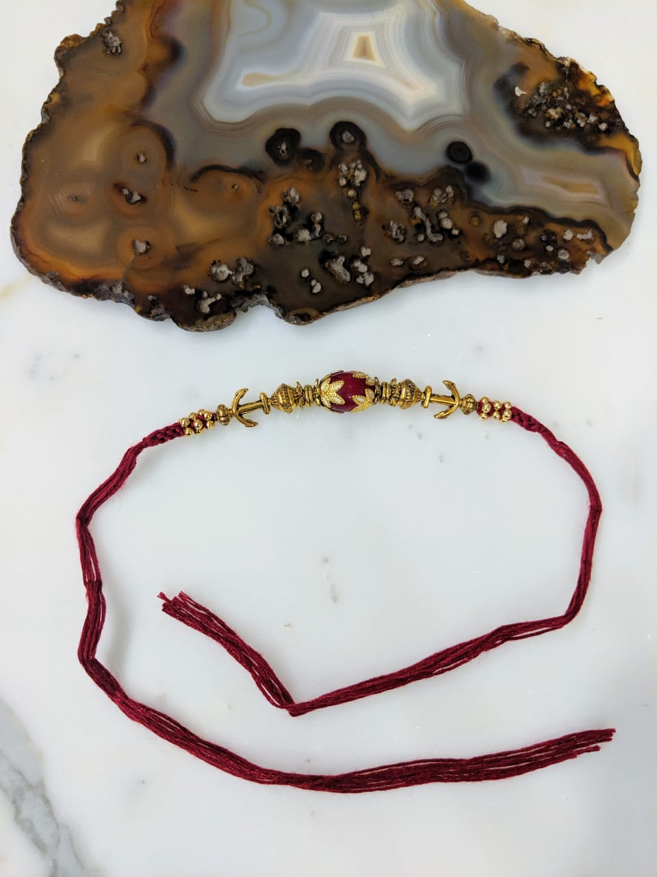 image for Tibetan Designer Gold Plated Red Gemstone Multicolor Thread Rakhi For Men