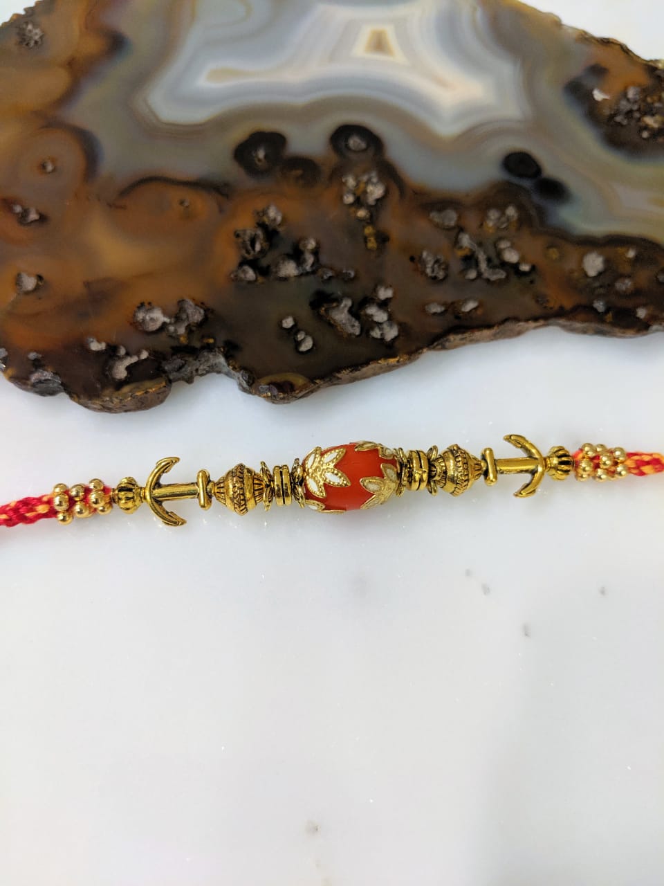 image for Gold Plated Rakhi with Orange Gemstone Multicolor Thread Rakhi For Men