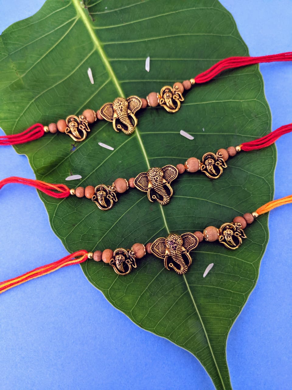 image for (Set of 3) Designer Rakhi with Gold Plated OM Ganpati Bappa Tulsi Beads Thread Rakhi