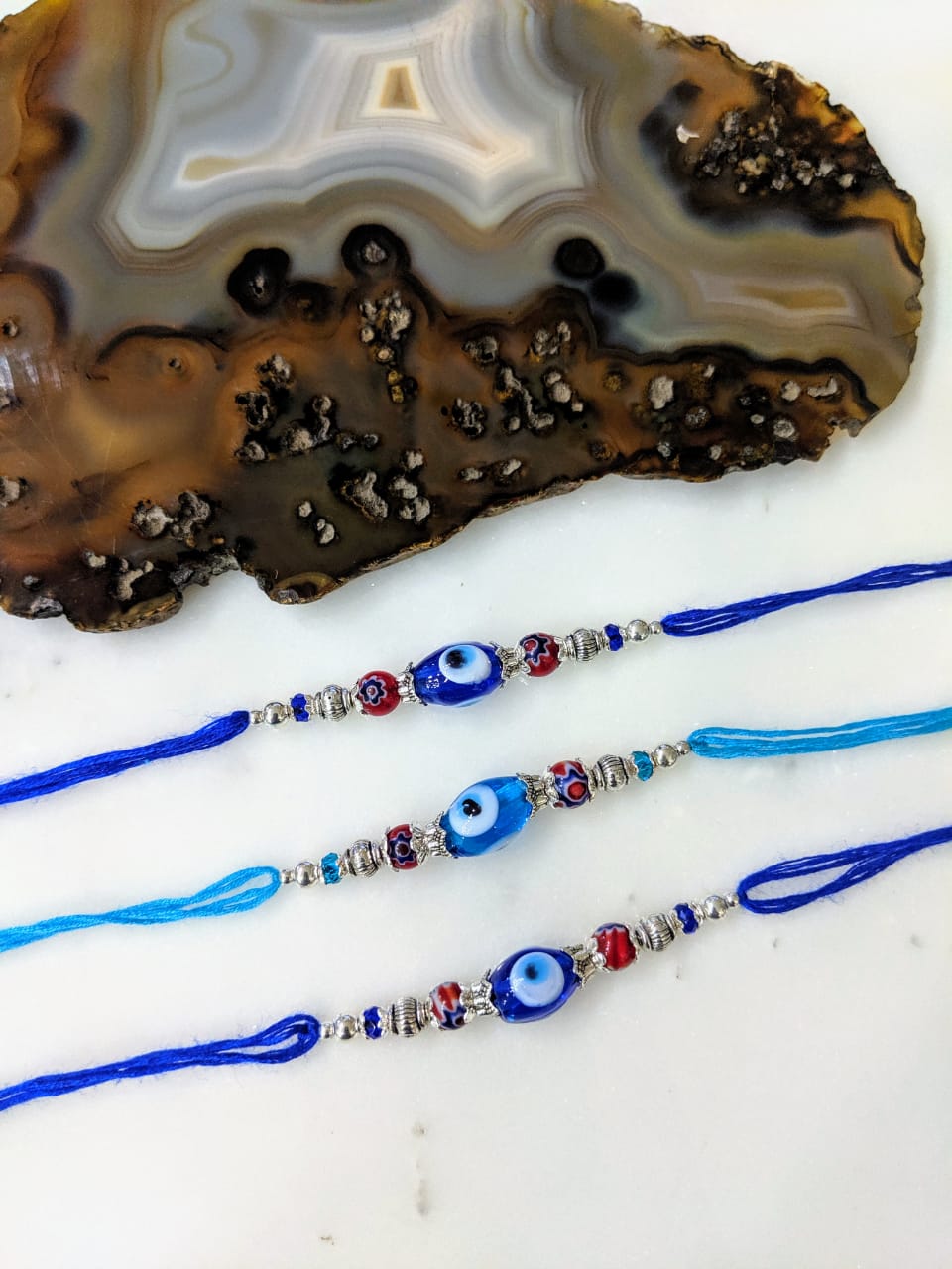 image for (Set of 3) Evil Eye Rakhi for Men Silver Navy Blue Beads Multicolor Thread Rakhi