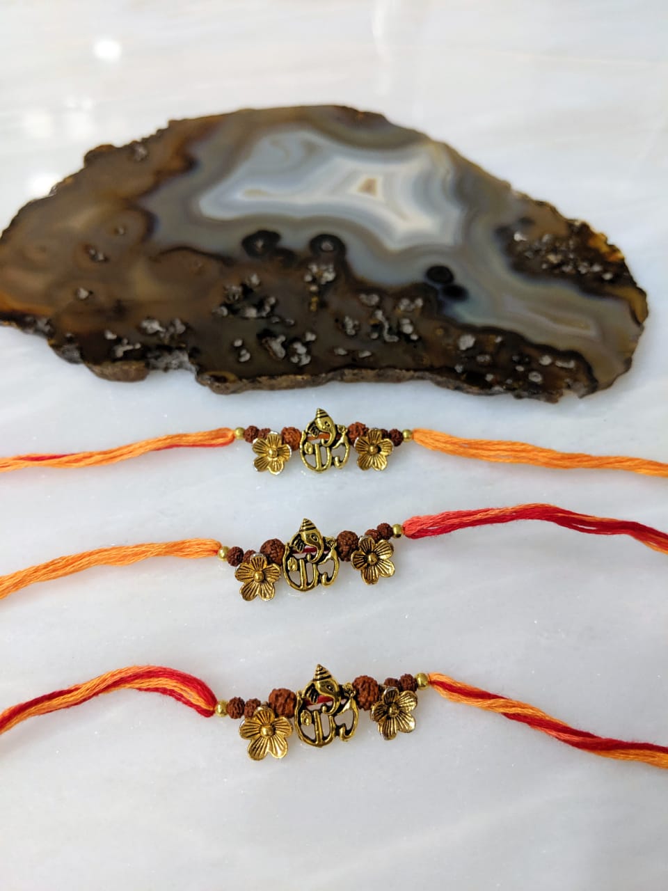 image for (Set of 3) Ganesh Ji Rakhi for Men Gold Flower Rudraksha Beads Rakhi