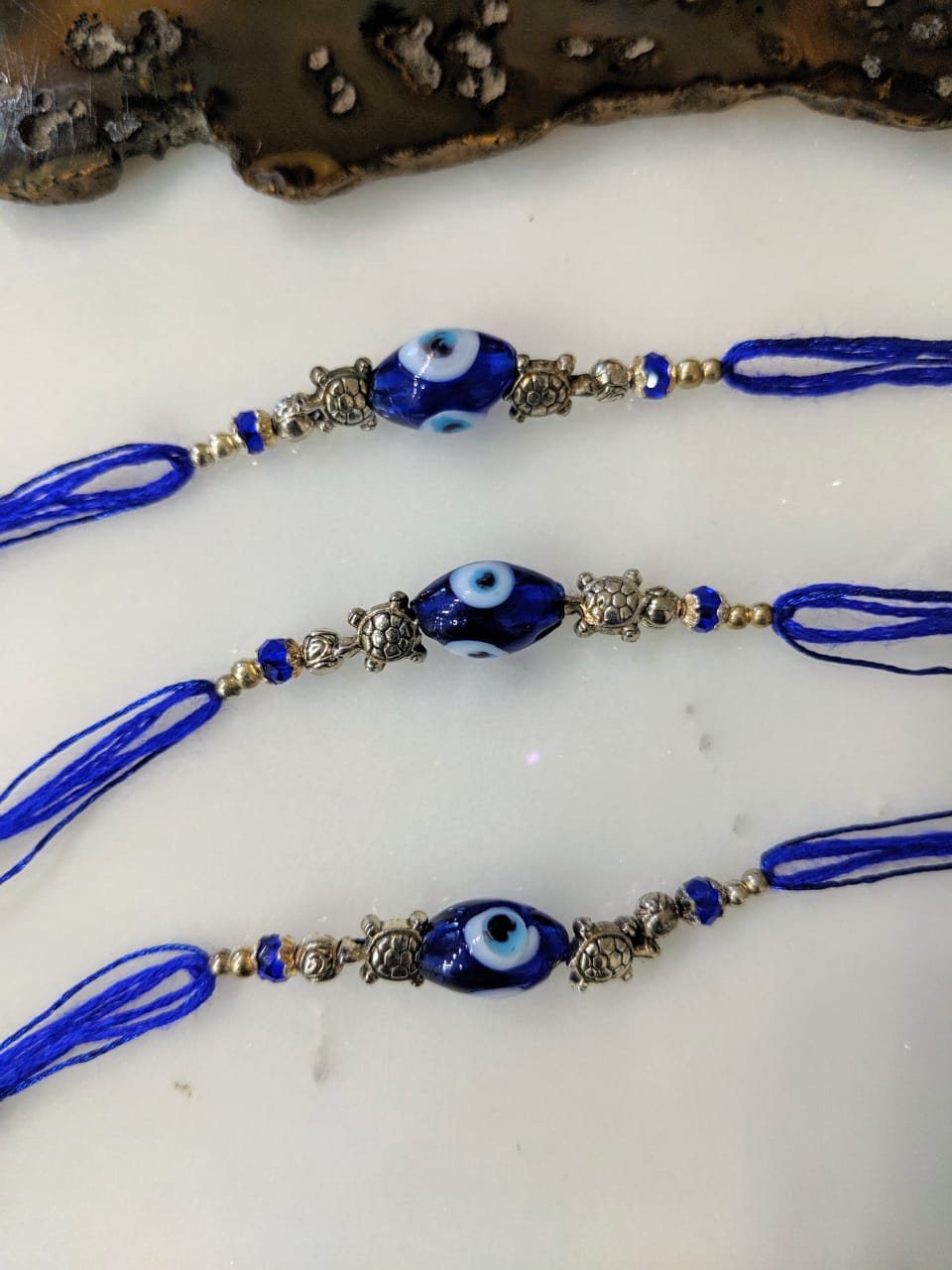 image for (Set of 3) Navy Blue Evil Eye Rakhi with Tortoise Designer Silver Beads Thread Rakhi For Men