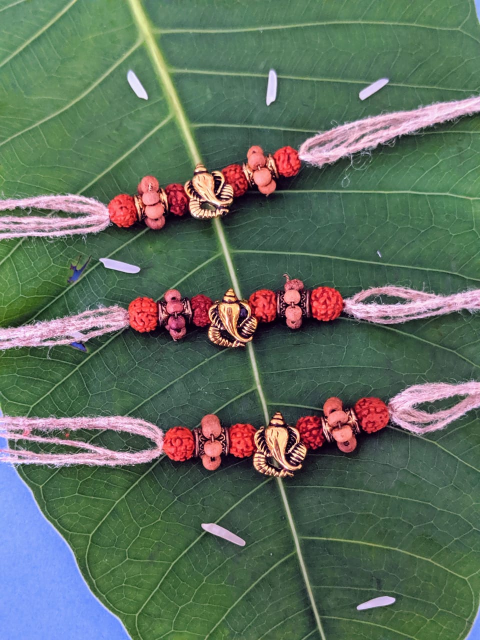 image for COMBO of 3 Rakhi Design Ganesha with Rudraksha/Tulsi Beads Pendant Mauli Thread For Raksha Bandhan