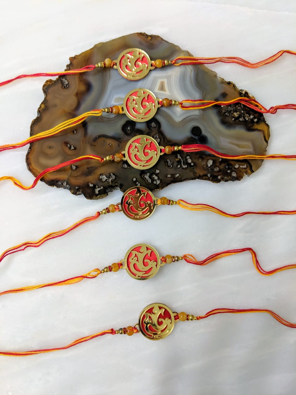 image for (Set of 6) Gold Plated Rakhi with Ganesh Ji & Beads Red Thread Rakhi For Men