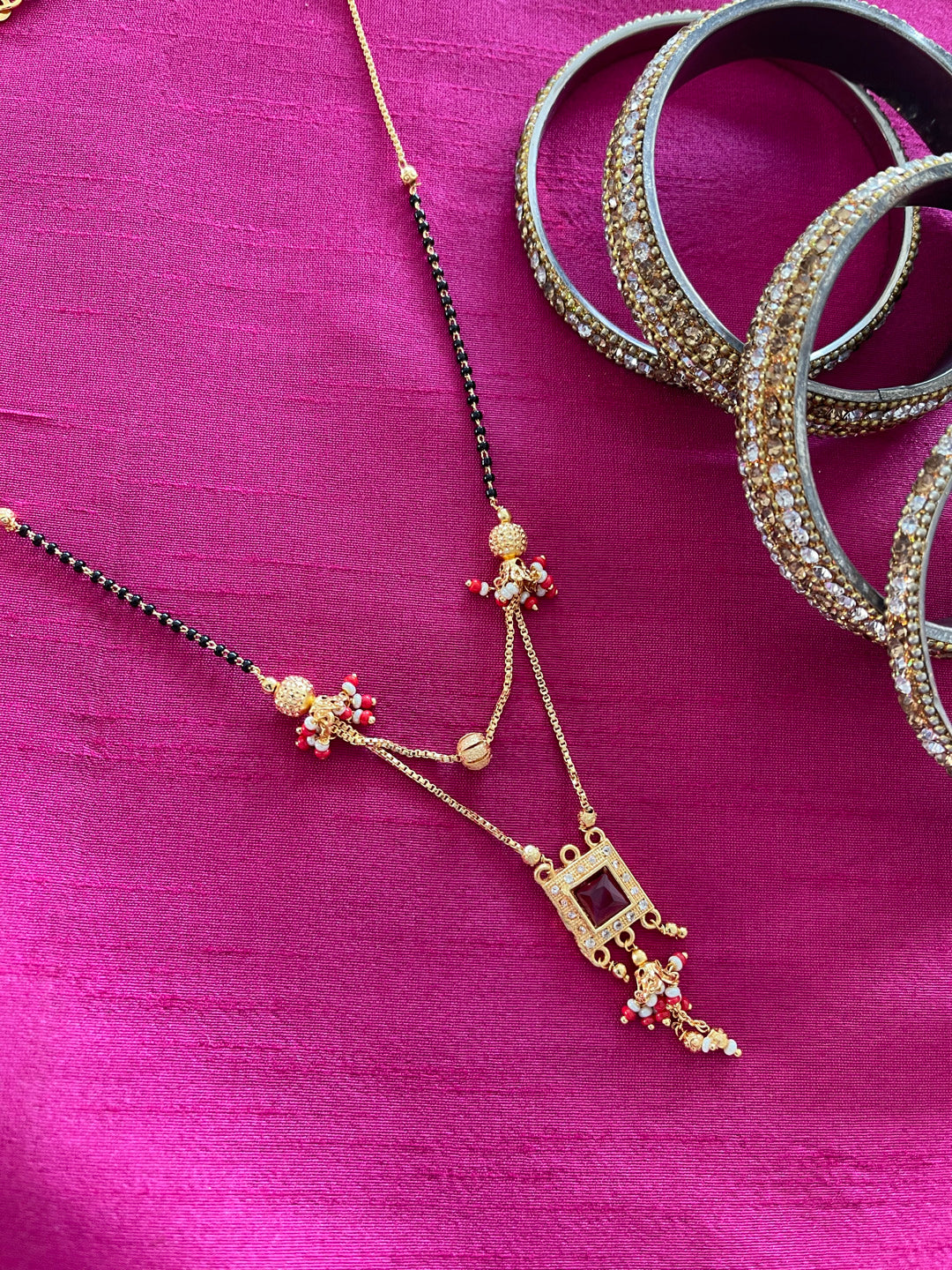 image for Short Mangalsutra Designs simple gold mangalsutra Red Stone in Square Pendant black beads chain