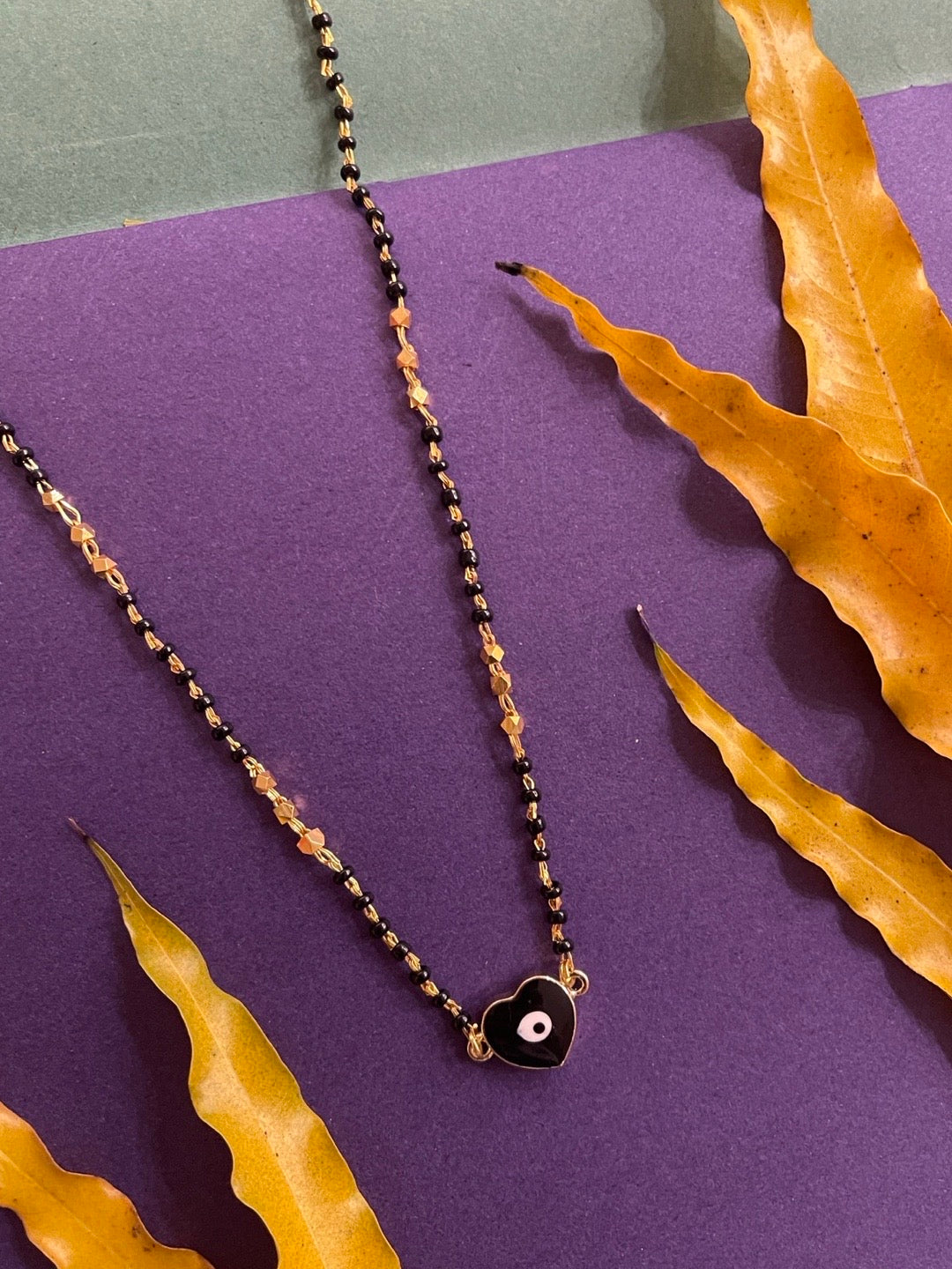 image for Short Modern Mangalsutra Designs Gold Plated Heart & Evil Eye Pendant Simple Gold & Black Beads Chain