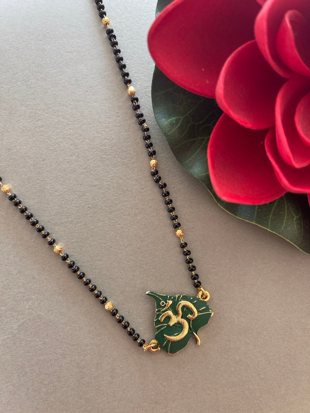 image for Gold Plated Trendy Long Mangaslutra Designs Leaf/Om Pendant Simple Gold And Black Beads Chain