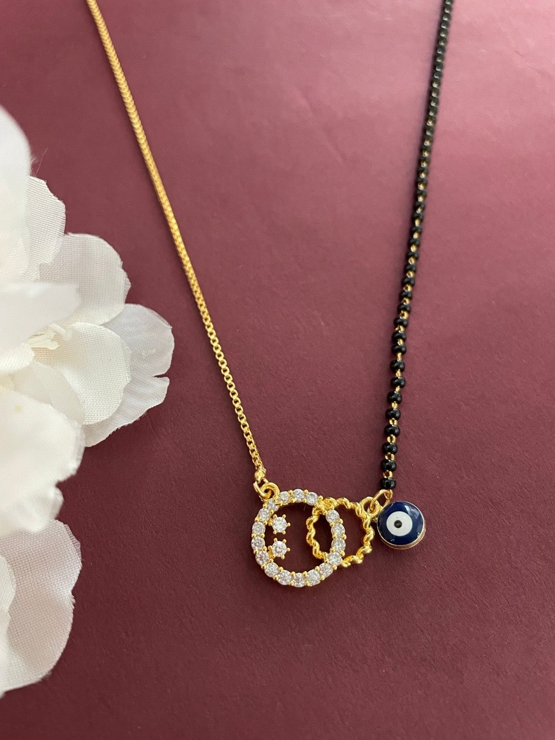 image for Gold Plated Modern Short Mangalsutra With AD Pendent & Dark Blue Evil Eye Charm