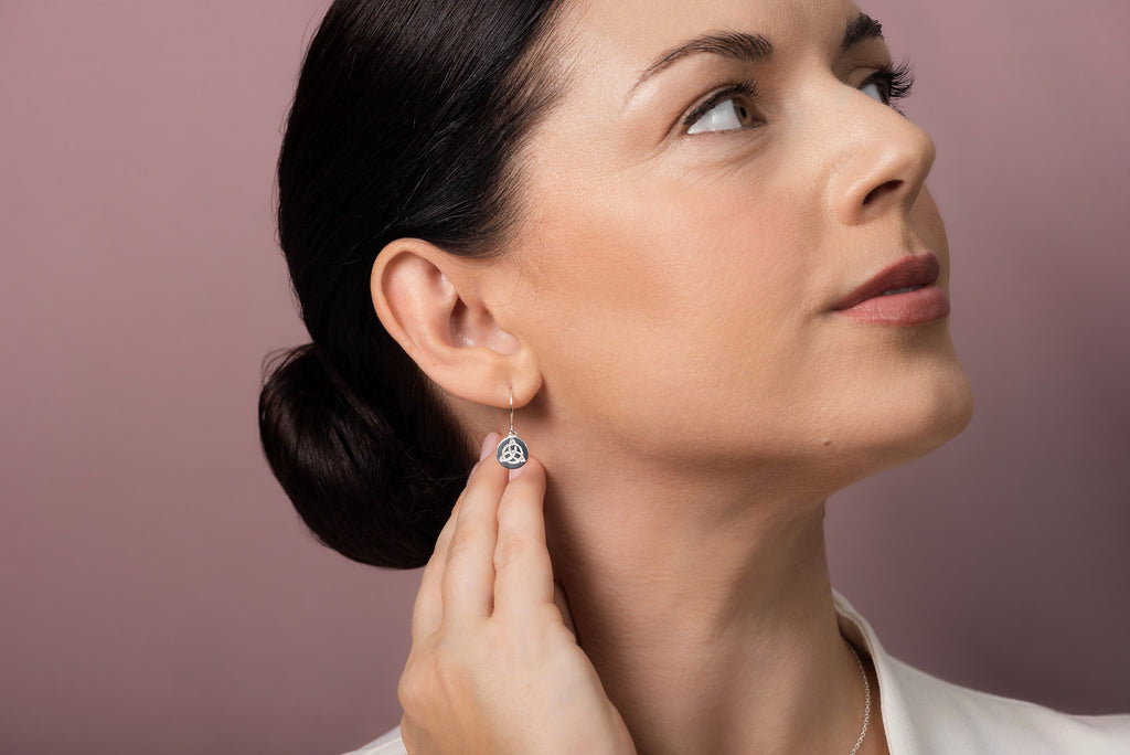 Liwu Jewellery model wearing with triskele silver earring 