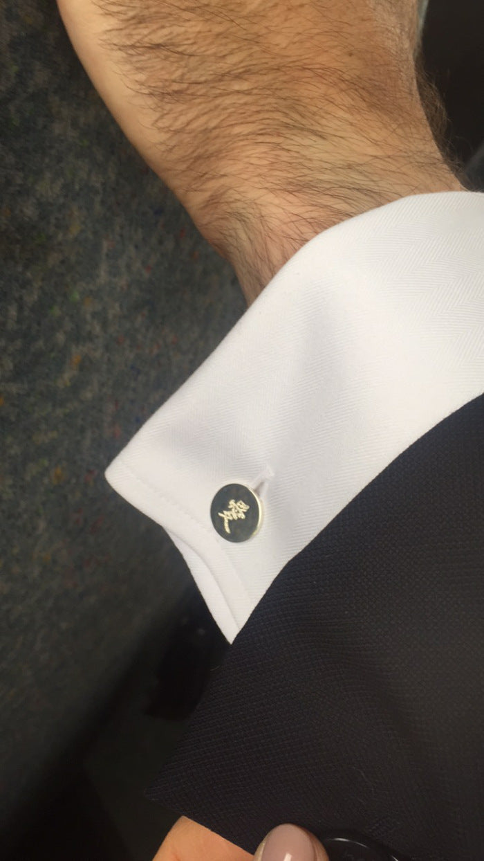 Man wearing Liwu cufflink with chinese characters