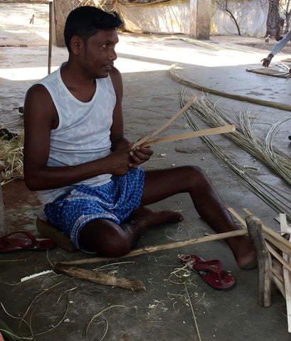 Bamboo strips 'Patta' are first made by the artisans
