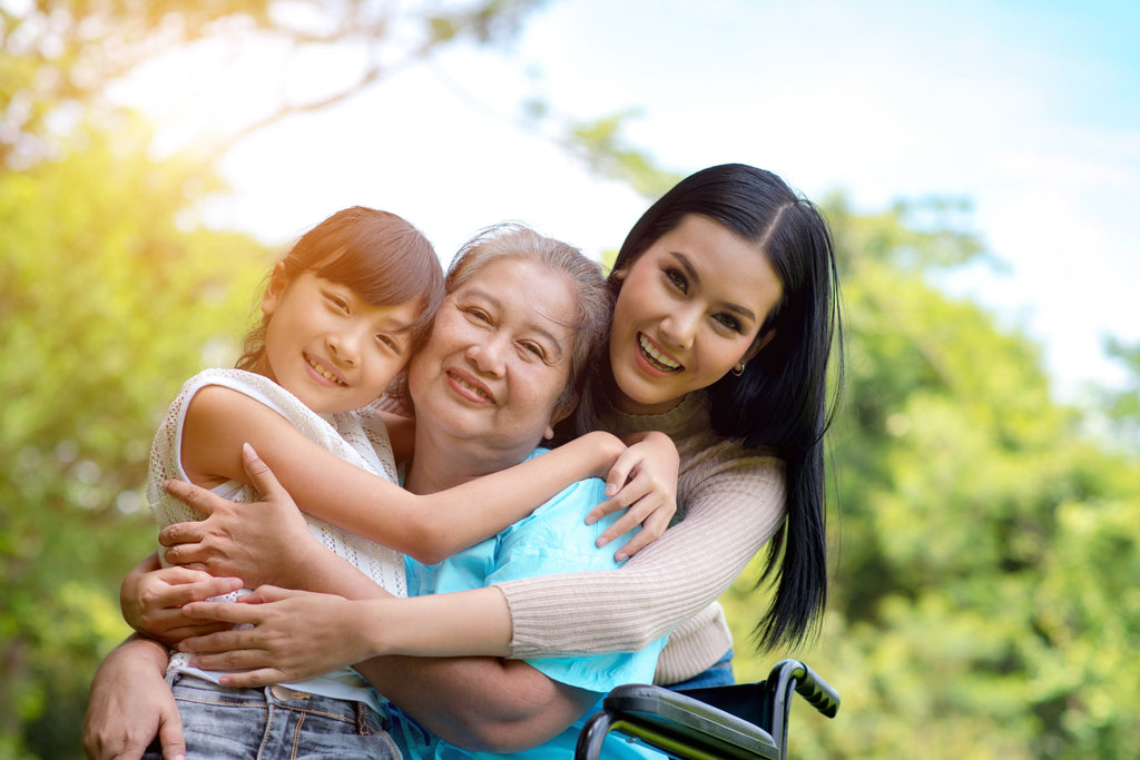 granddaughter, grandmother and mother smiling and hugging