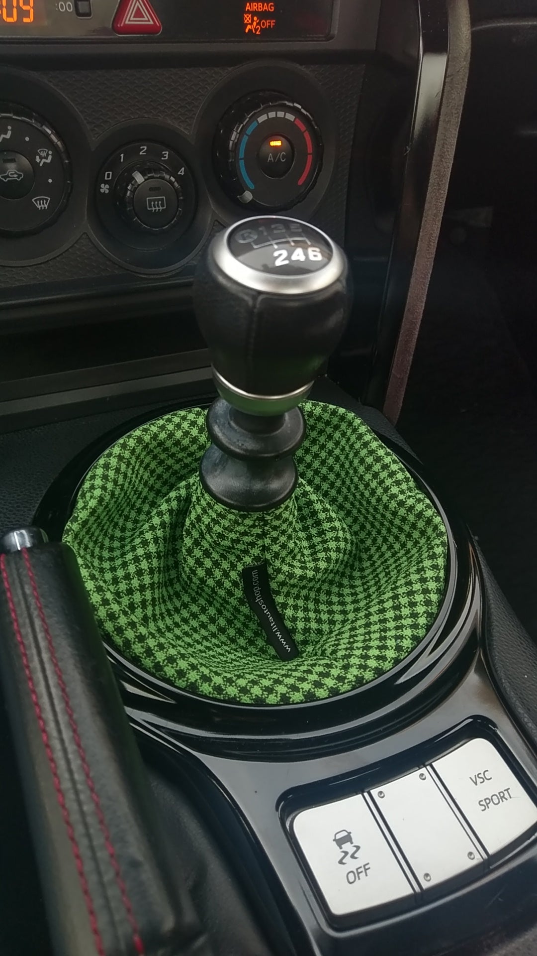 Green Checkered Shift Boot Lit Auto Shop