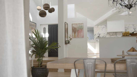 White home interior with abstract art hanging on wall