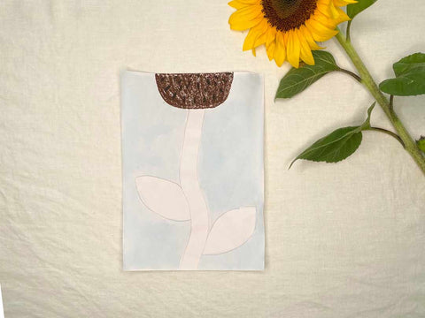 Paint the background of your sunflower with watercolour