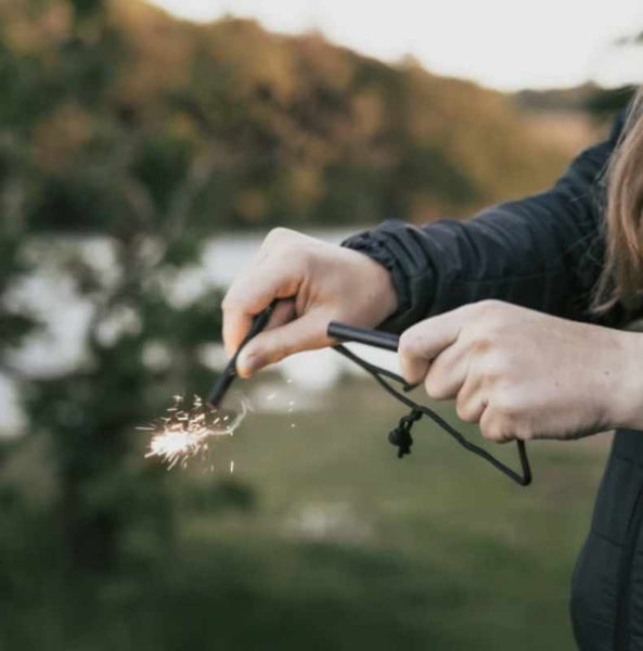 woman using fire starter