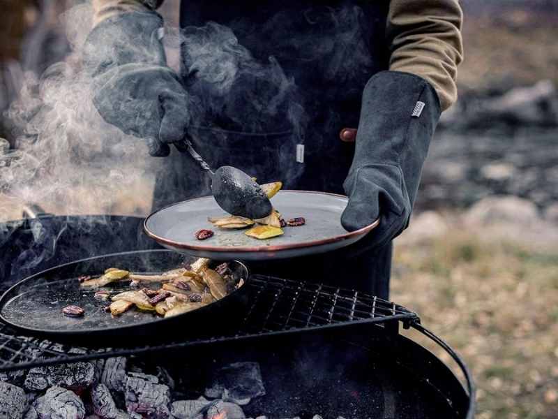 cooking over a campfire with open fire gloves