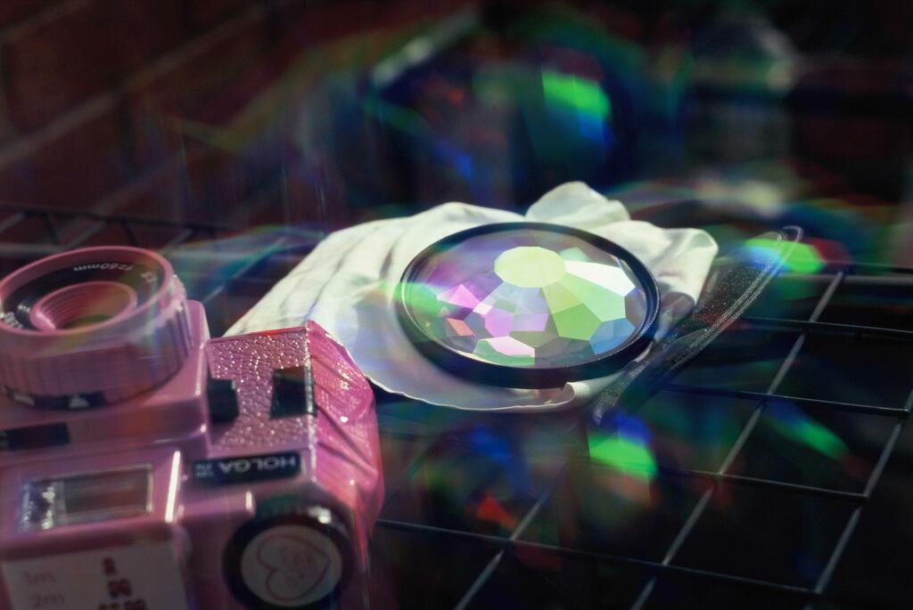 Kodak Film Shortage- what to shoot| close up of pink holga and prism lens with rainbow reflections