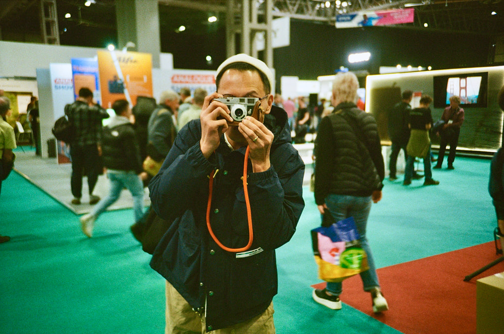 Man taking a photo on film from The Photography Show