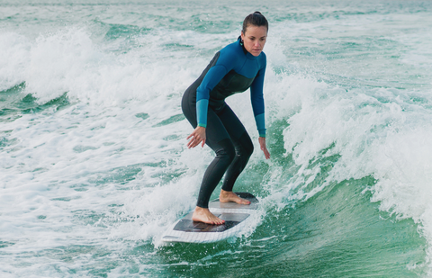 Beginner surfer with a surfboard