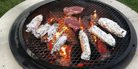 Foil Packets and Steak Cooking on Grilling Grate